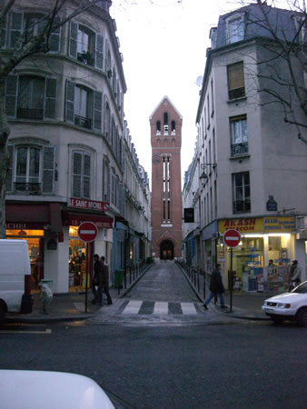 [Paris.+This+church+was+in+an+interior+courtyard.+The+red+brick+bell+tower+fit+nicely+between+the+two+gray+apartment+buldings..jpg]