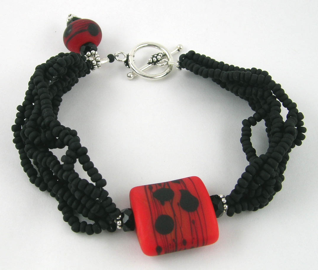 [red+and+black+bracelet.jpg]
