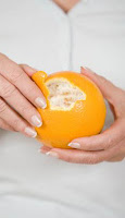 Woman Peeling an Orange