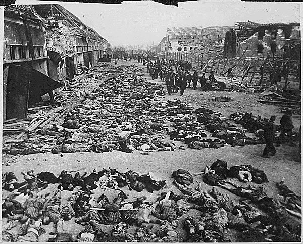 [Rows_of_bodies_of_dead_inmates_fill_the_yard_of_Lager_Nordhausen,_a_Gestapo_concentration_camp.jpg]