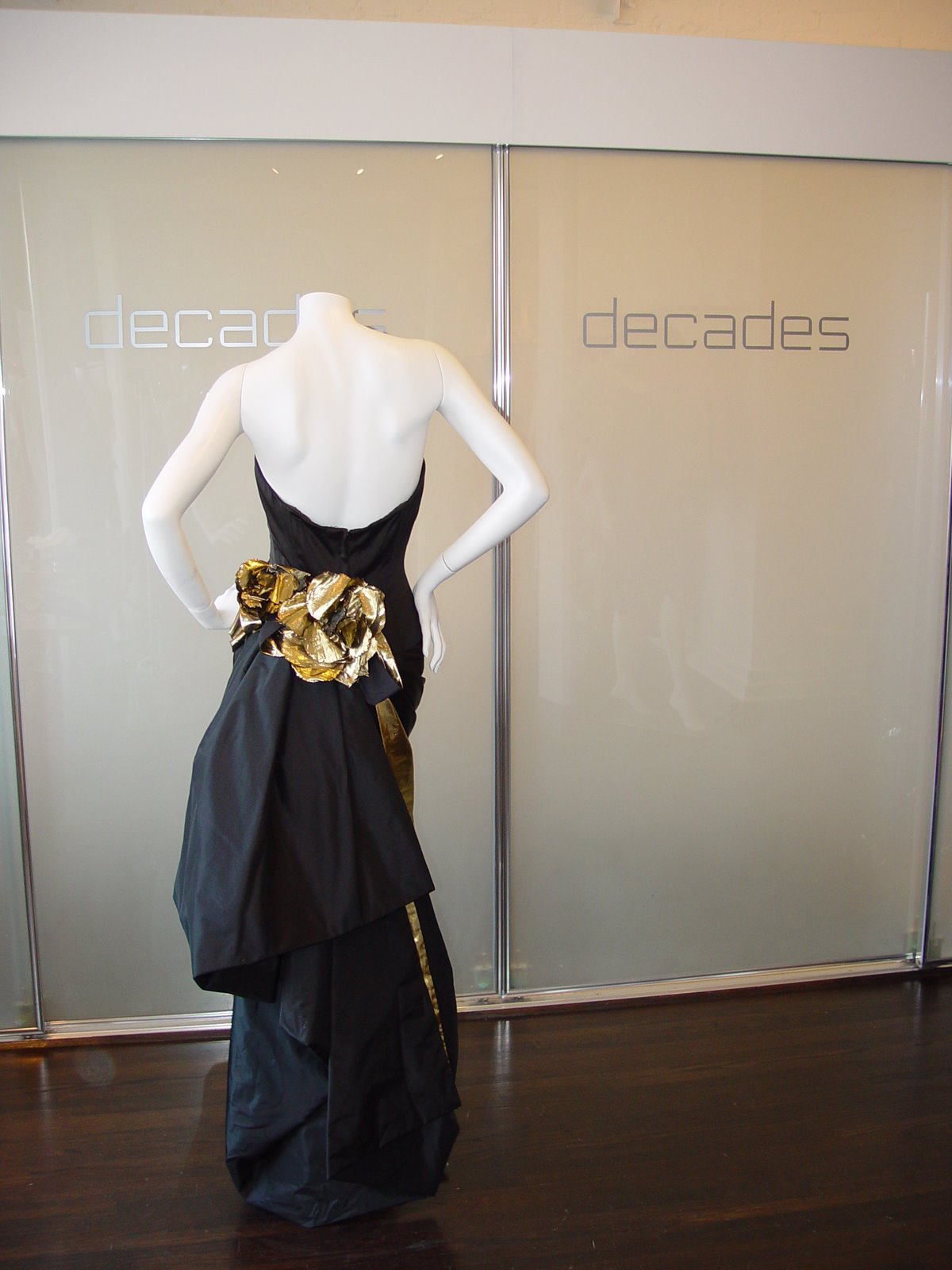 [GAIL+SIMMONS+BLACK+SILK+SATIN+GOWN+WITH+GOLD-PIPED+BUSTLE+-+BACK.JPG]