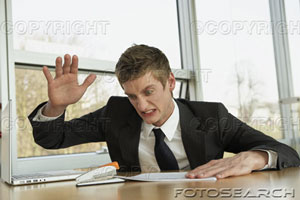 [businessman-sitting-in-an-office-and-looking-angry-~-u13284944.jpg]