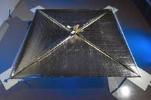 Photon flight: NASA’s NanoSail-D is a small satellite that can move through space using a solar sail propelled by pressure from photons. The sail, fully expanded to 10 square meters in this image, is a very thin sheet of plastic coated with aluminum.