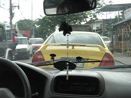 Manila traffic as seen through a taxi's windshield