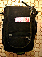 a black bag with a chain on the side