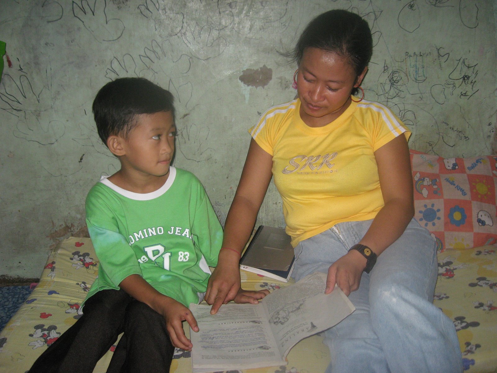 [Sponsored+child+Dante+and+mom+Jocelyn+on+a+reading+sessioJocelyn+is+now+able+to+help+her+children+in+their+homework+after+her+stint+in+the+PAGASA+Adult+Literacy+Program.jpg]