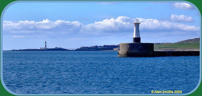 Peterhead's South Breakwater with Buchanness Lighthouse in the background.