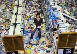 (c) BBC - Image of Gisborne library post-earthquake, with books scattered all over the floor