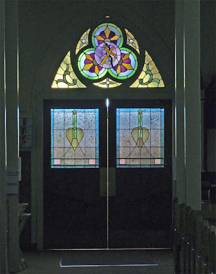Immaculate Conception Catholic Church, in Columbia, Illinois, USA - Stained glass in the front door into the nave