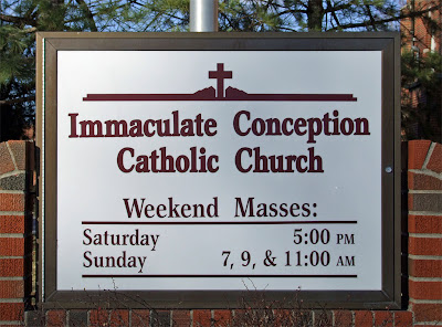 Immaculate Conception Catholic Church, in Columbia, Illinois, USA - sign with Mass times