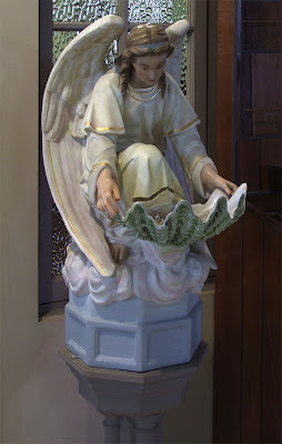 Saint John Nepomuk Roman Catholic Chapel, in Saint Louis, Missouri, USA - angel holy water font