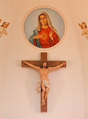 Immaculate Conception Roman Catholic Church, in Augusta, Missouri, USA - crucifix and painting of the Immaculate Heart of Mary