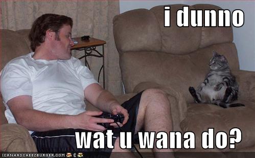 [funny-pictures-lounging-cat-guy-plays-videogames.jpg]