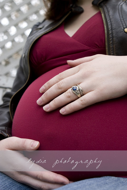  Wedding ring and hand on belly at lifestyle maternity portraits in Grass Valley, California