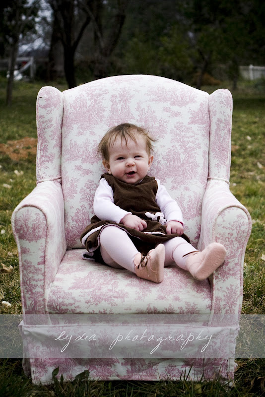 Baby yawning in the chair at lifestyle baby portraits in Grass Valley, California