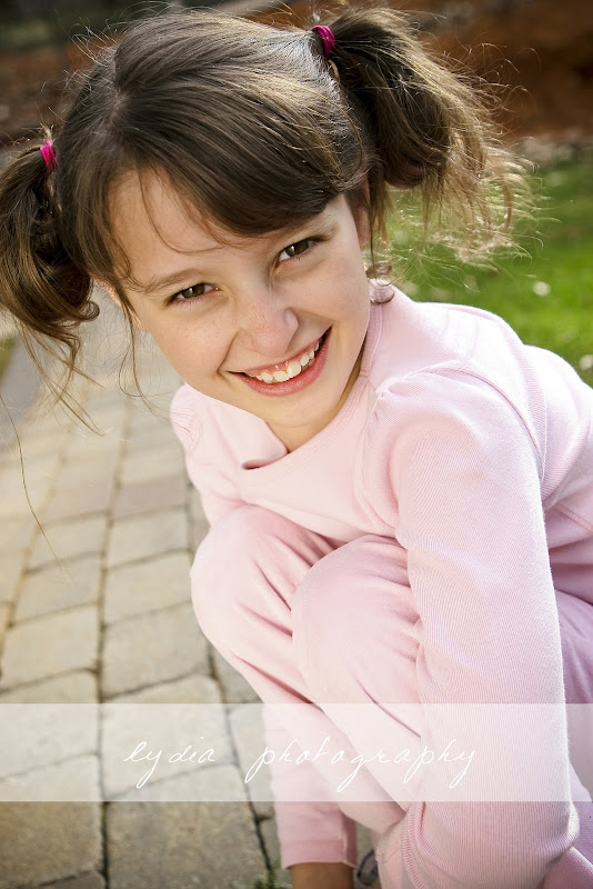 Little girl with pink pants and shirt at lifestyle kids portraits at Grass Valley, California
