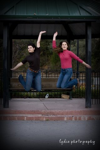 Sisters jumping in the air at lifestyle sister portraits in Colfax, California