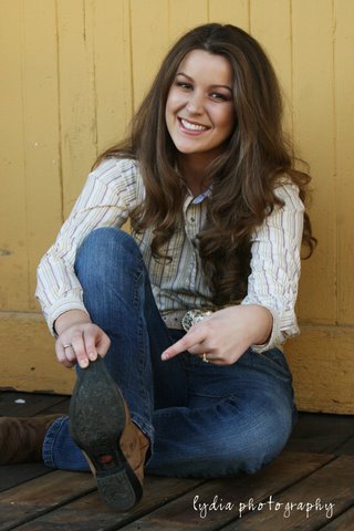 Senior pointing to her boot at lifestyle senior portraits in Colfax, California