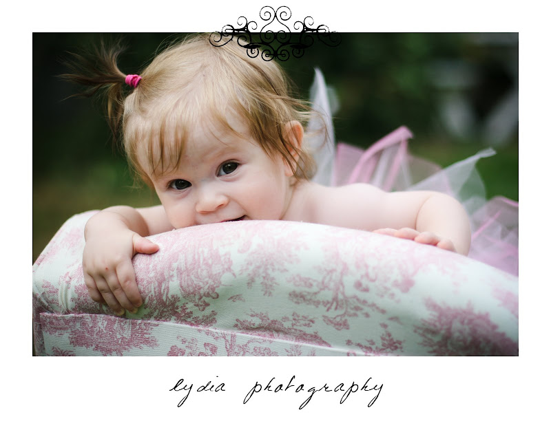 Baby holding onto chair at lifestyle baby portraits in Grass Valley, California