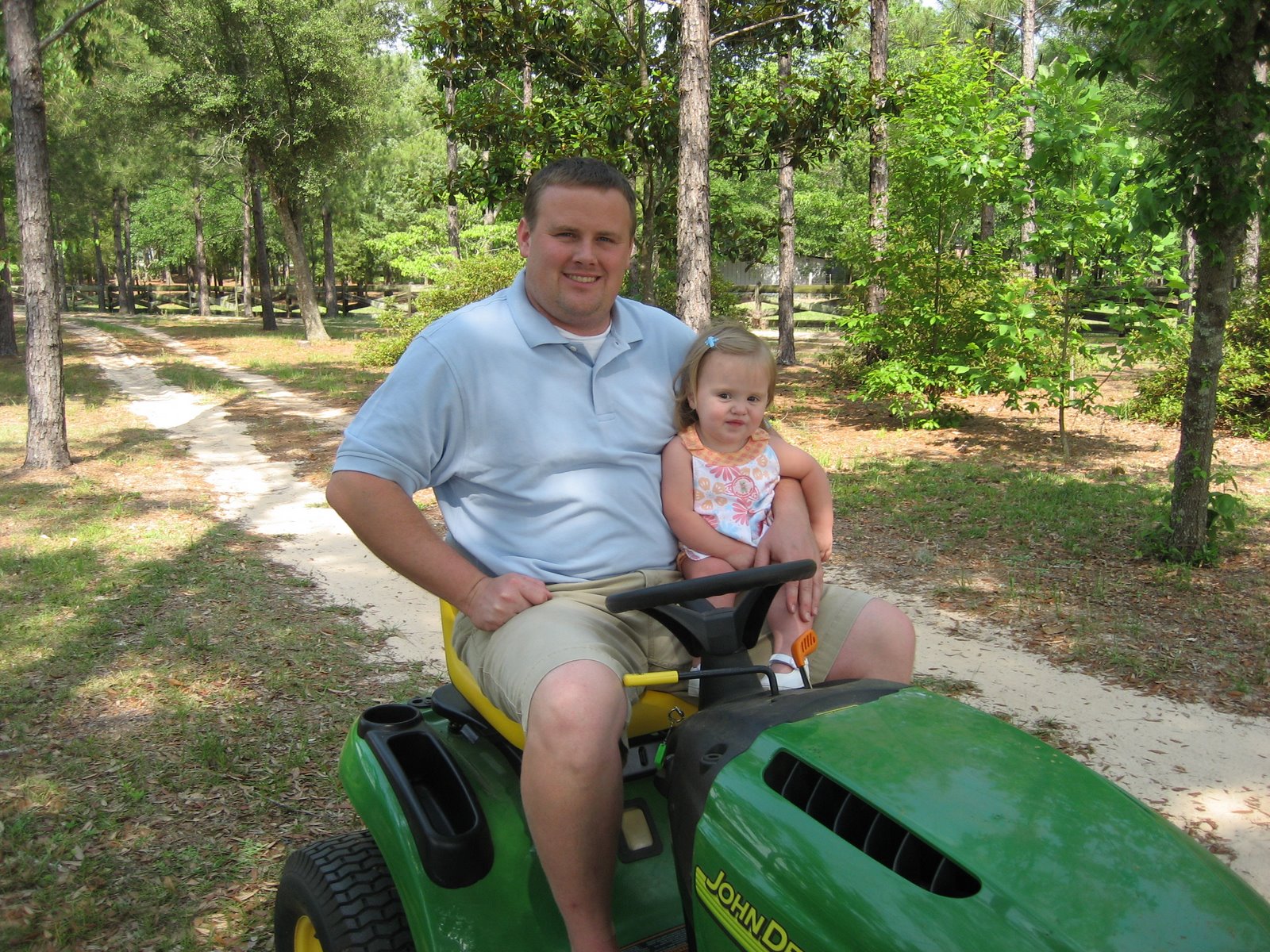 [daddy+and+vivian+on+tractor.JPG]
