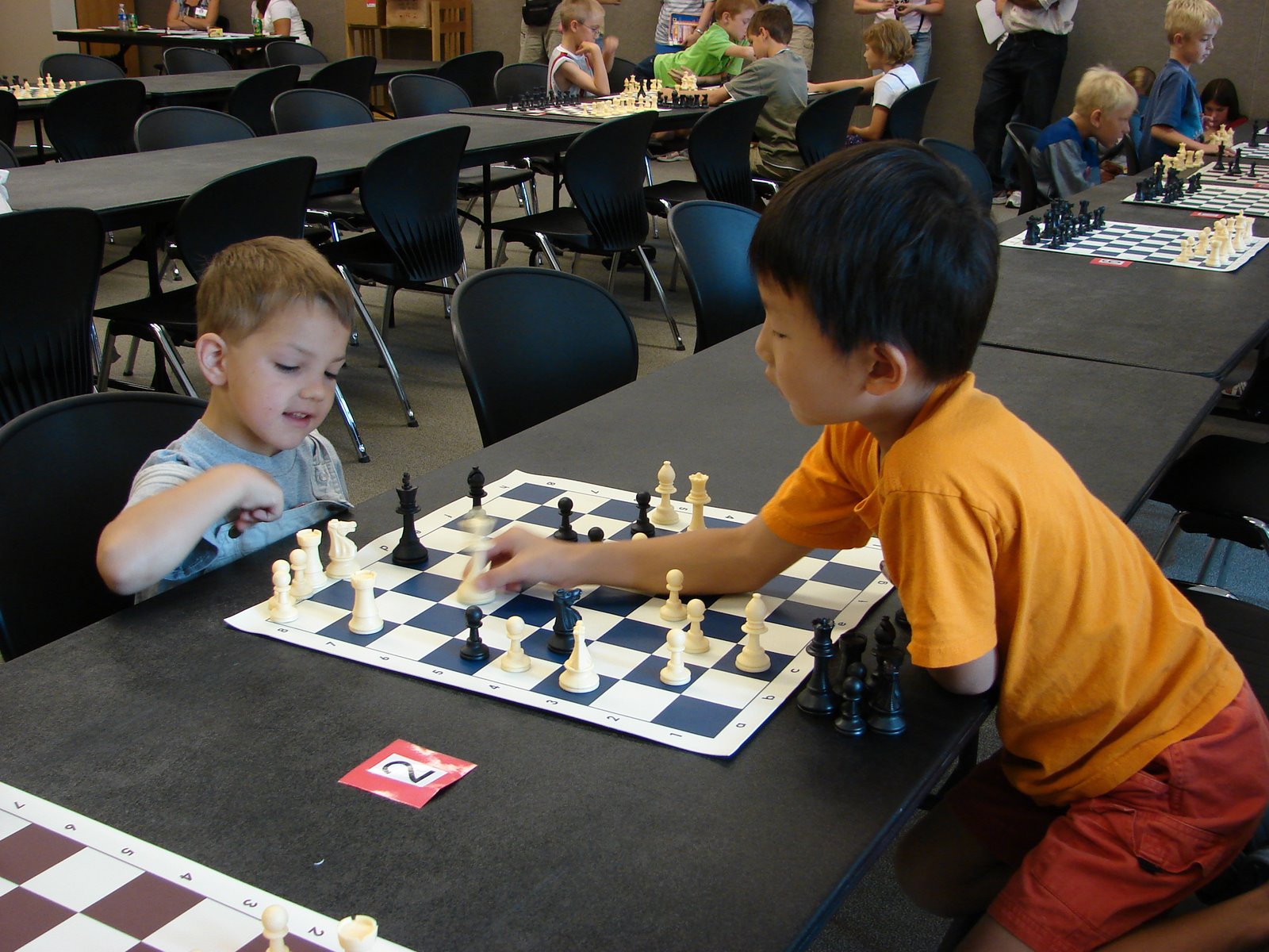 [Two+of+our+younger+chessplayers+enjoy+the+tournament.JPG]