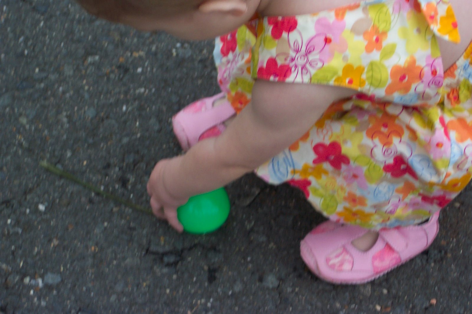 [toddler+bends+to+pick+up+egg.jpg]