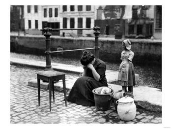 [A-Woman-Weeps-at-the-Roadside-Beside-Her-Worldly-Treasures-WWI-Antwerp-Belgium-August-1914.jpg]