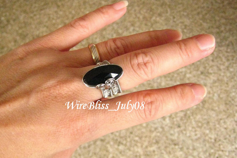 wire wrapped adjustable black onyx rings on my finger