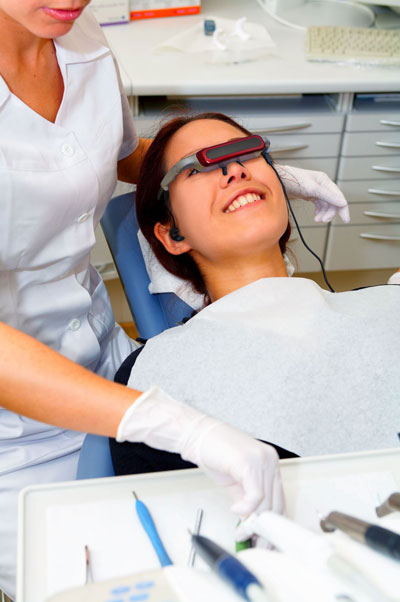 [web-photo-of-patient-distraction-with-video-eyewear-at-dentist.jpg]