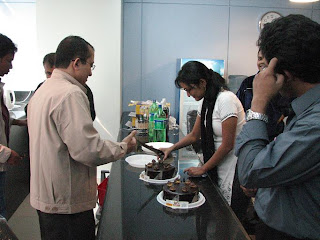 Nazifa apa is cutting the cake to distribute amongst everybody