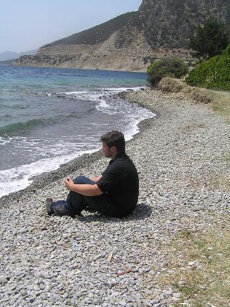 [christopher+sitting+on+the+beach+of+med+sea.jpg]