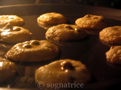 chocolate chip cookies baking in the oven