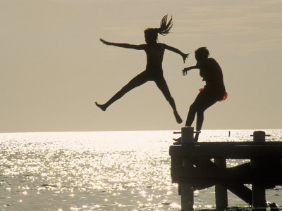 [213939-FB~Silhouette-of-Girls-Jumping-off-Pier-Posters.jpg]