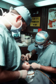 [180px-Dental_surgery_aboard_USS_Eisenhower,_January_1990.JPEG]
