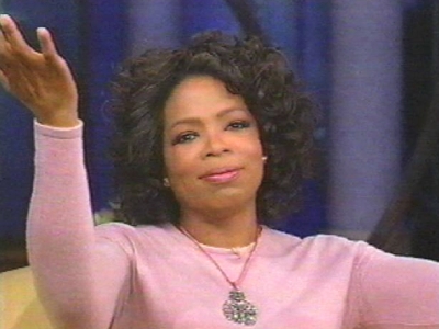 [oprah+with+hands+up.jpg]