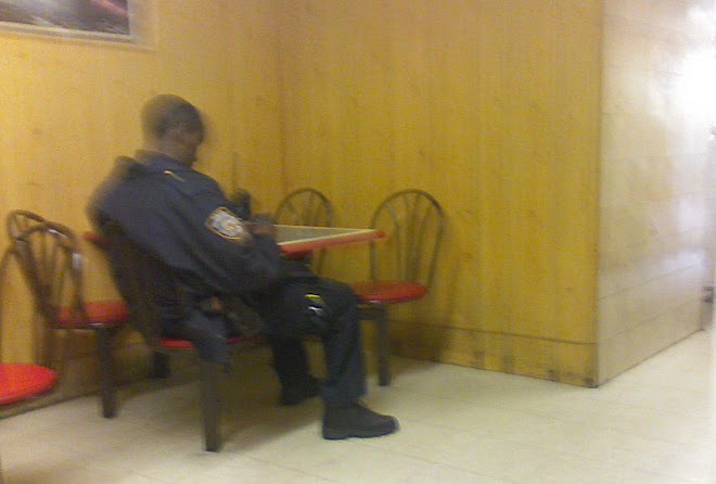 Officer Playing a PSP in a Brownsville pizzeria