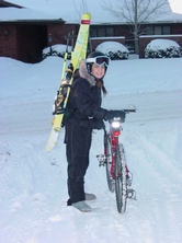 [girl+riding+with+skis+on+back.jpg]
