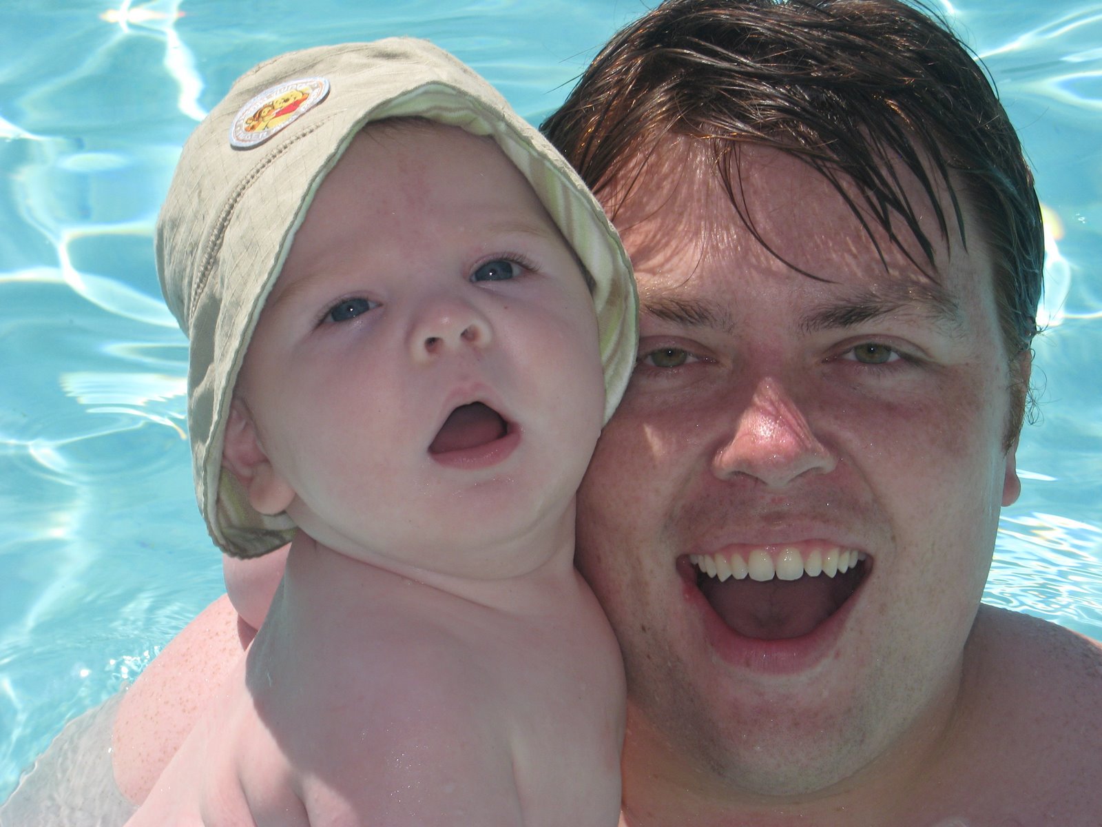 [swimming+with+daddy.JPG]