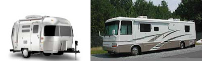 A gleaming Airstream trailer at left, a swoosh-painted, bus-size RV at right