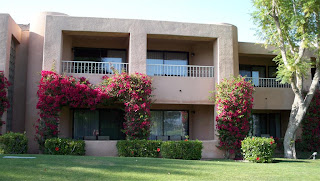 a building with flowers on the front