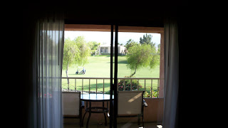 a view of a golf course from a balcony