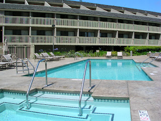 a swimming pool with a railing