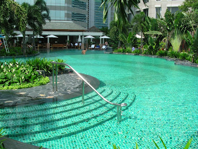 a swimming pool with a railing