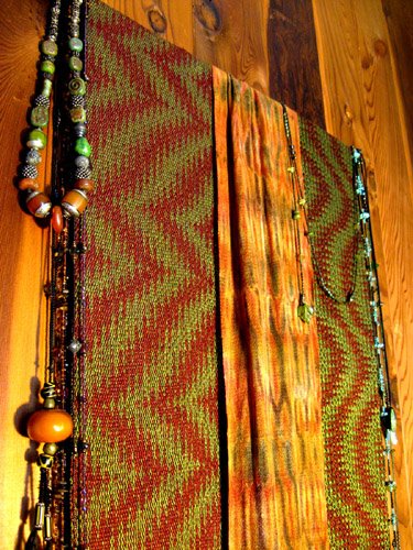 Tencel weavings displayed with jewelry