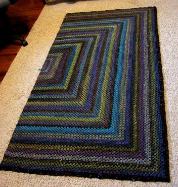 Granny square crocheted afghan of handspun yarns