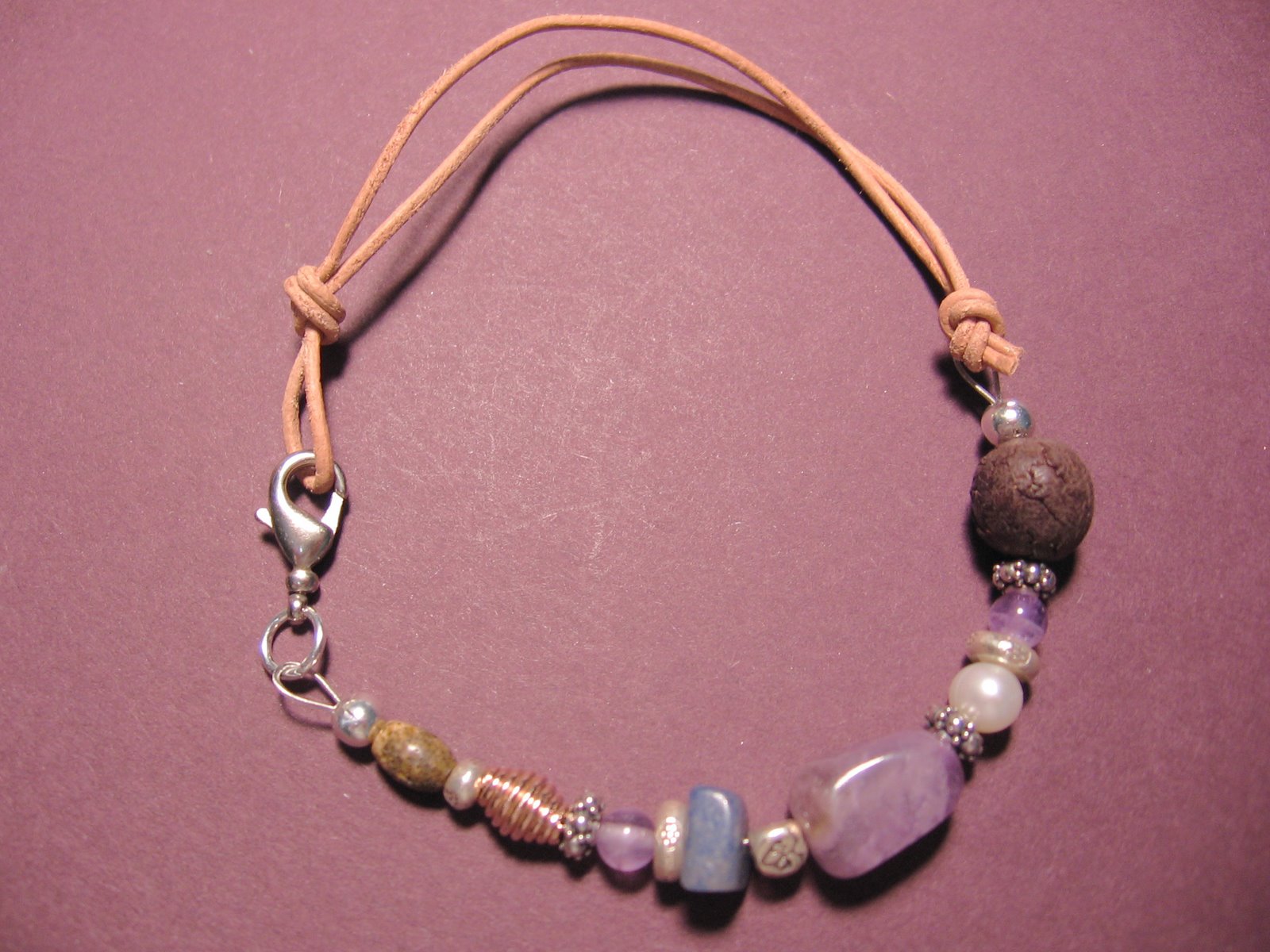 [#144+Amethyst+Multi+bracelet+on+purple.jpg]