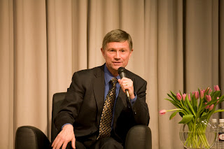 Bill Coleman, seated with mic