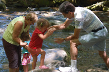 Grandpa & Grandma playing with Isabel and E-Beth in the river