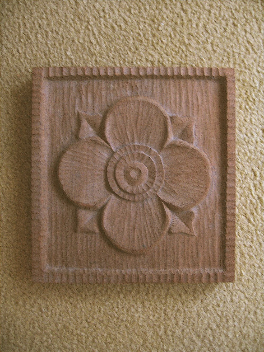 [flower+carved+in+redwood.jpg]