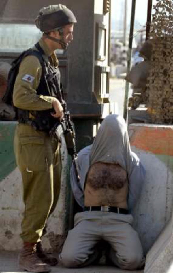[fascist+tsahal+arresting+palestinian.jpg]